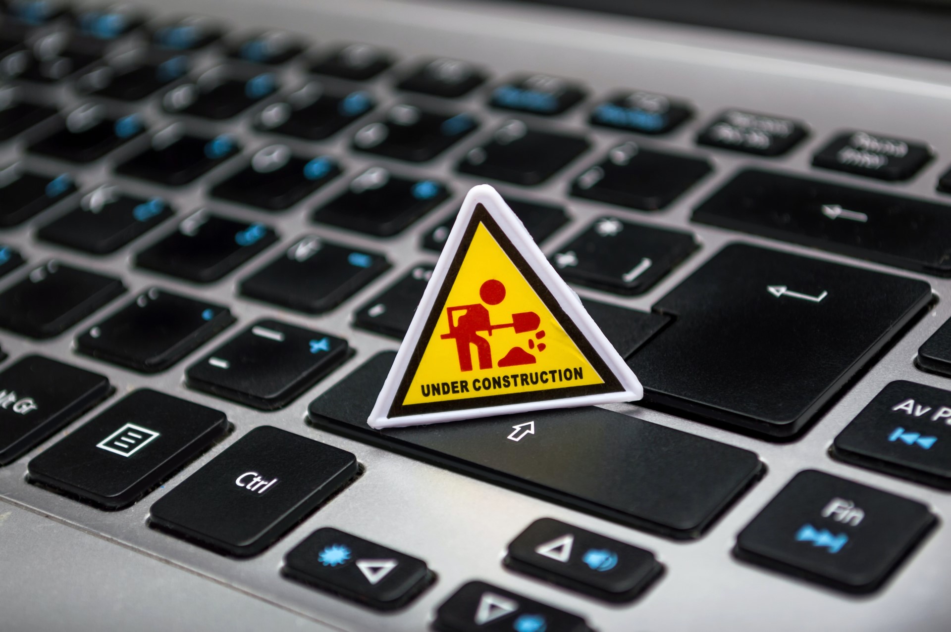 keyboard with under construction sign